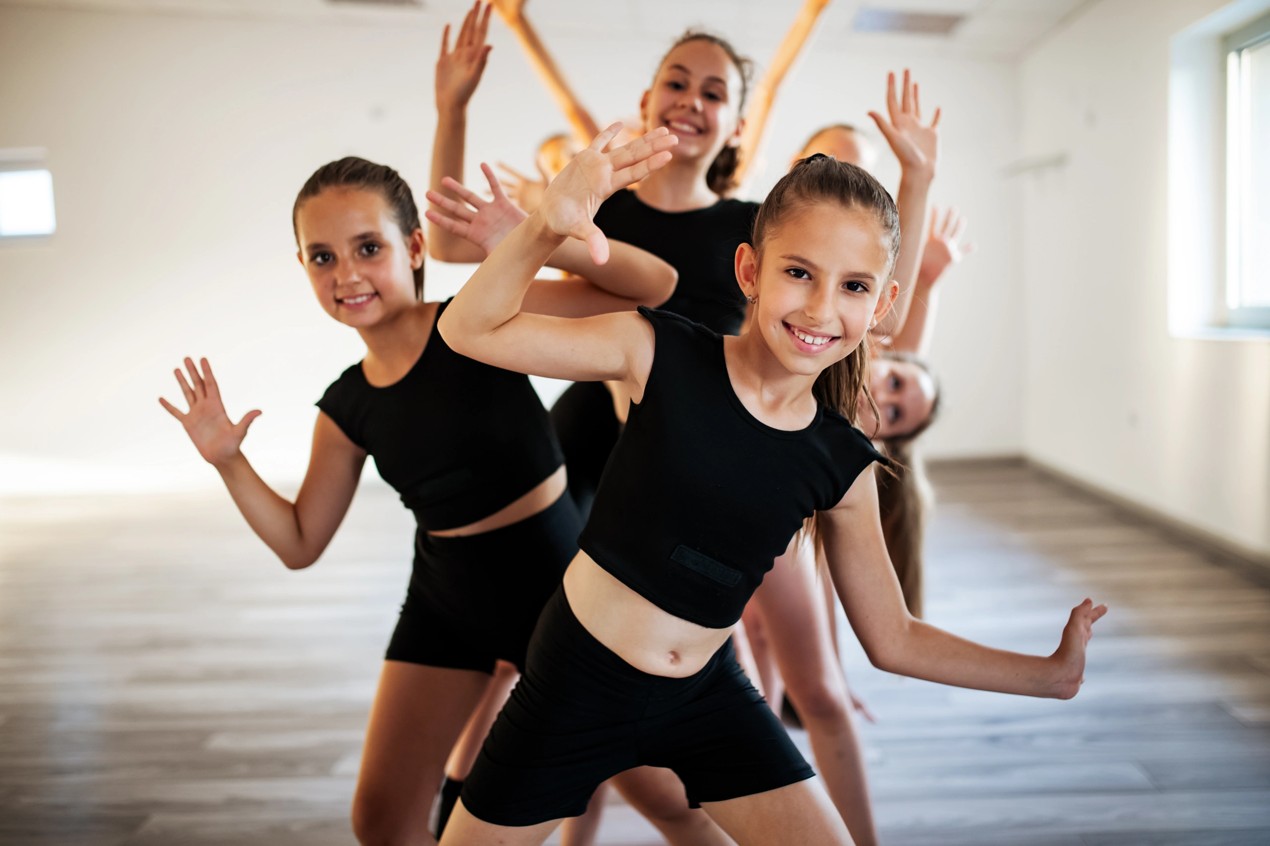 Happy dance students practicing to improve retention in class - Opus1: Everything You Need to Run Your School in One Place
