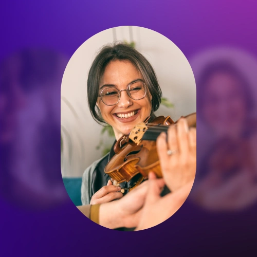 Young woman playing violin, close up