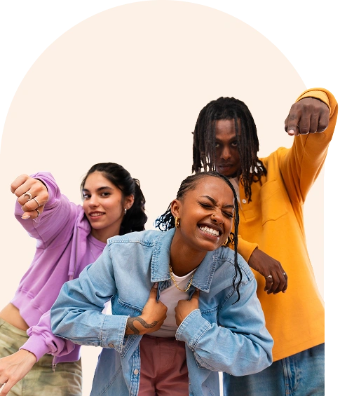 Dance students striking a pose and pointing at the camera