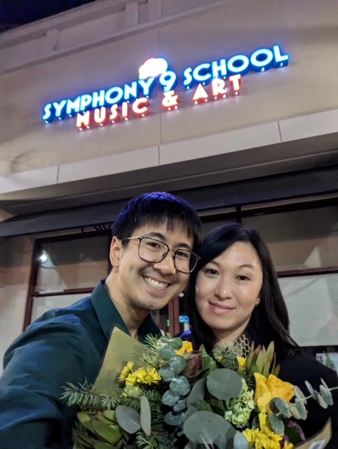 Jasmine & Lawrence Yu in front of their music school