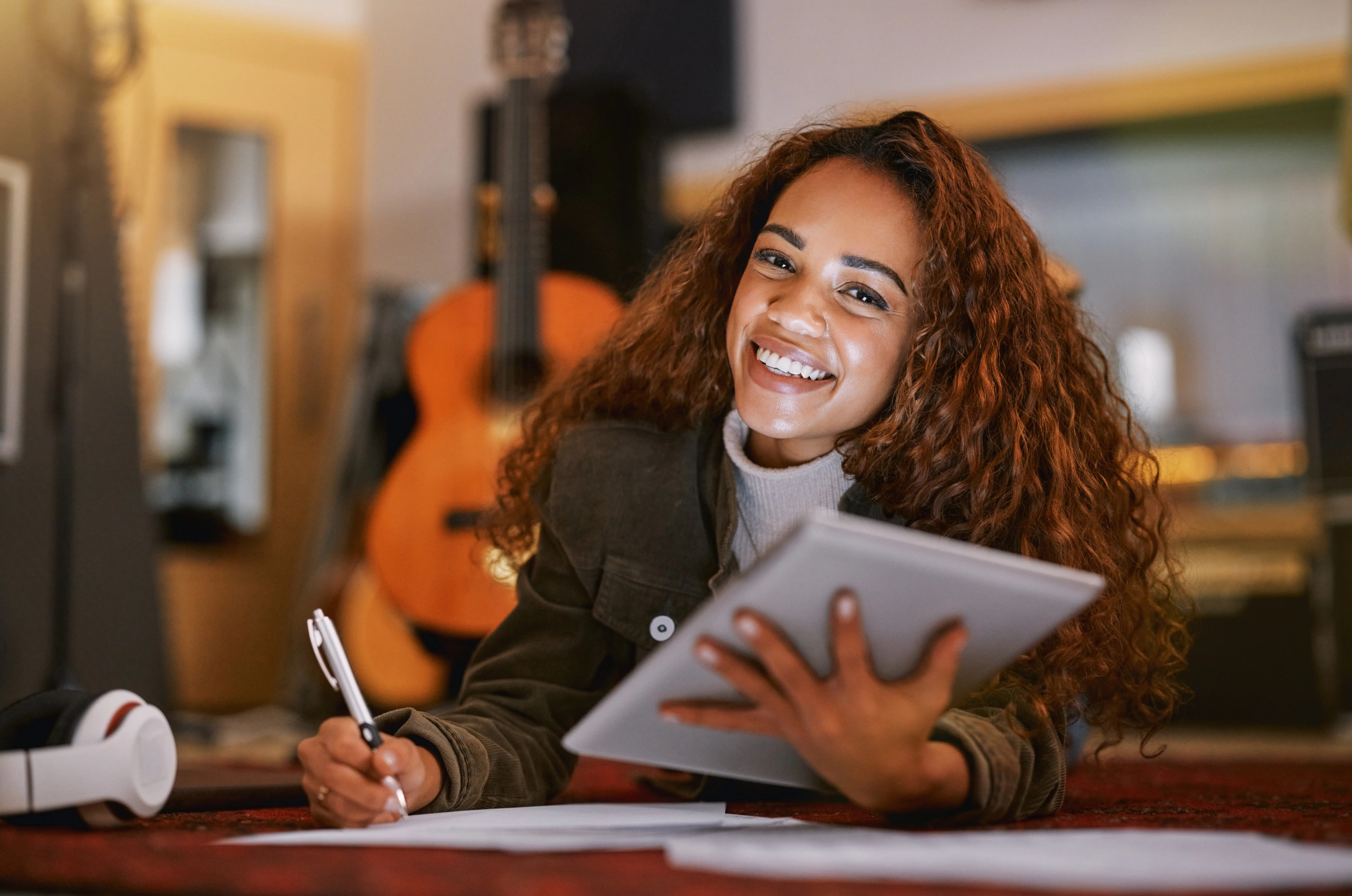 Woman works on tablet in a music studio
