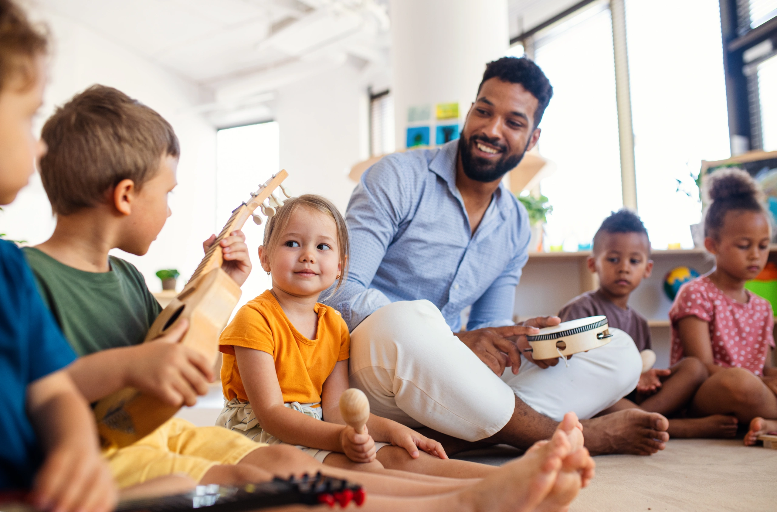 Children in classroom playing instruments