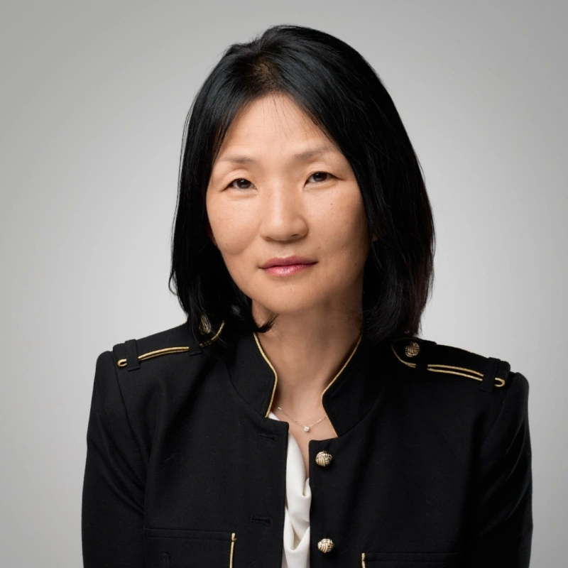 Portrait of Kyong Lee in a formal black jacket - Opus1: Everything You Need to Run Your School in One Place